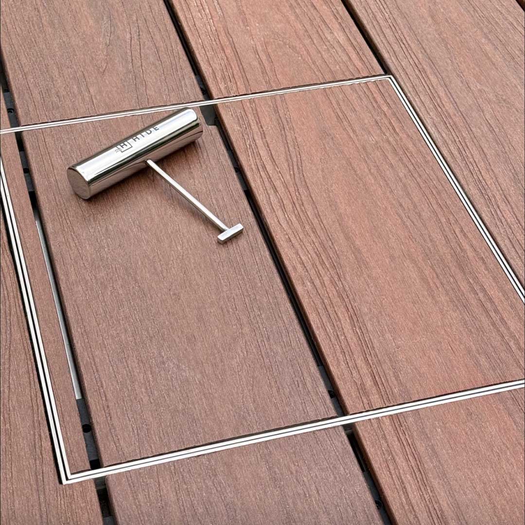 HIDE stainless steel safety lifting key resting ontop of HIDE Cover.