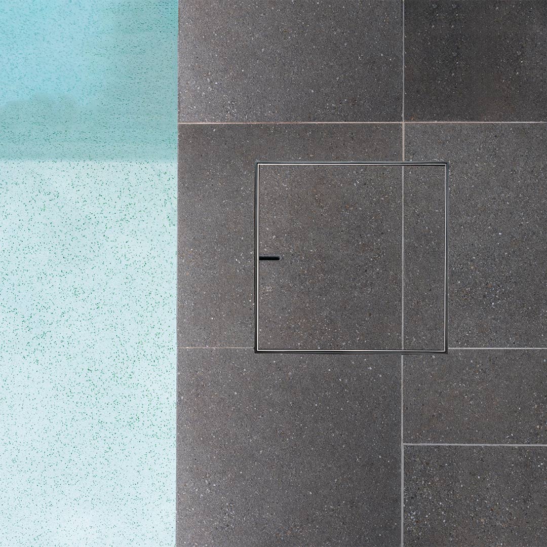 HIDE Stainless steel polymer non conductive Skimmer Lid installed next to swimming pool.