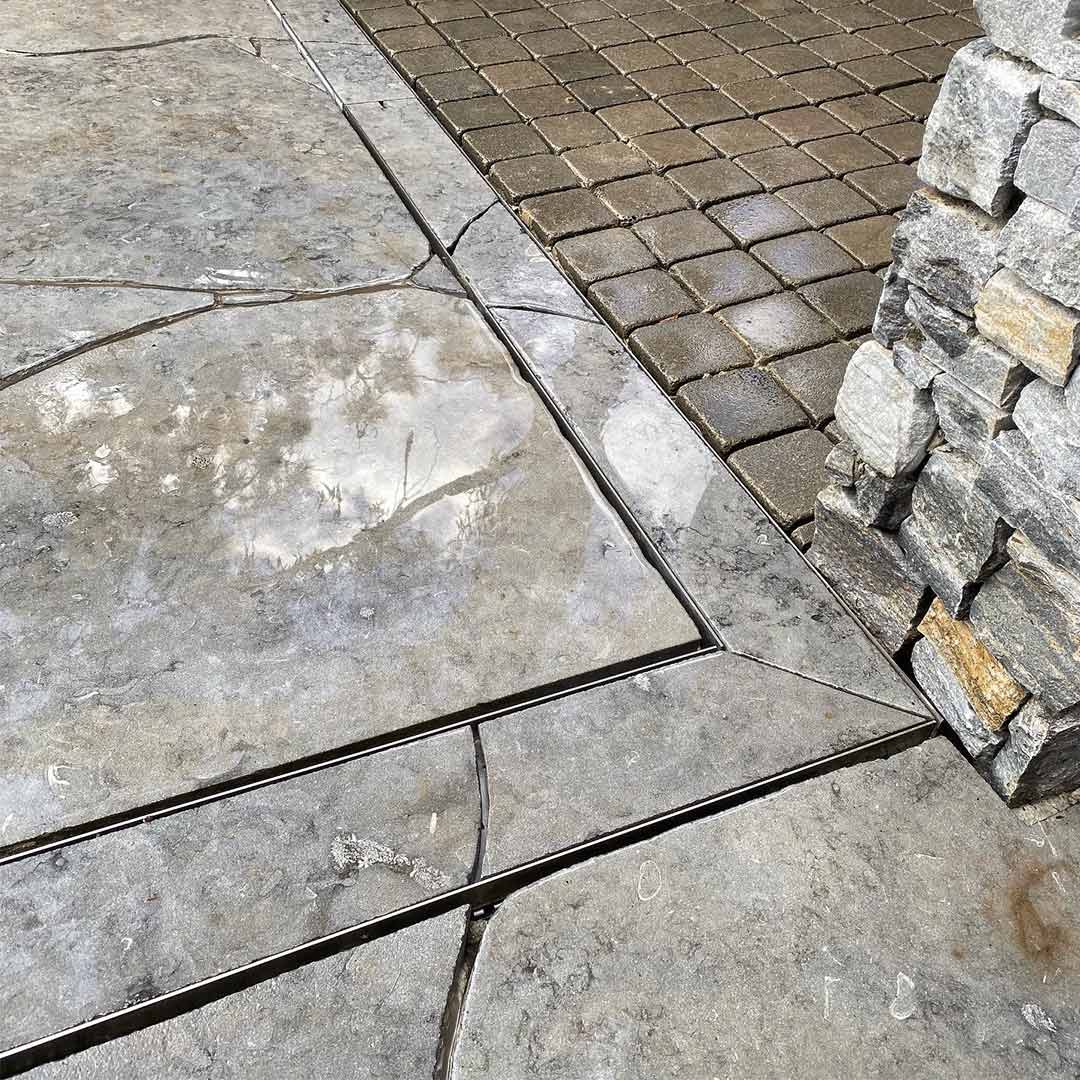 HIDE Tile Linear Strip Drain Cover Corner Kit with tile crazy pave inlay.