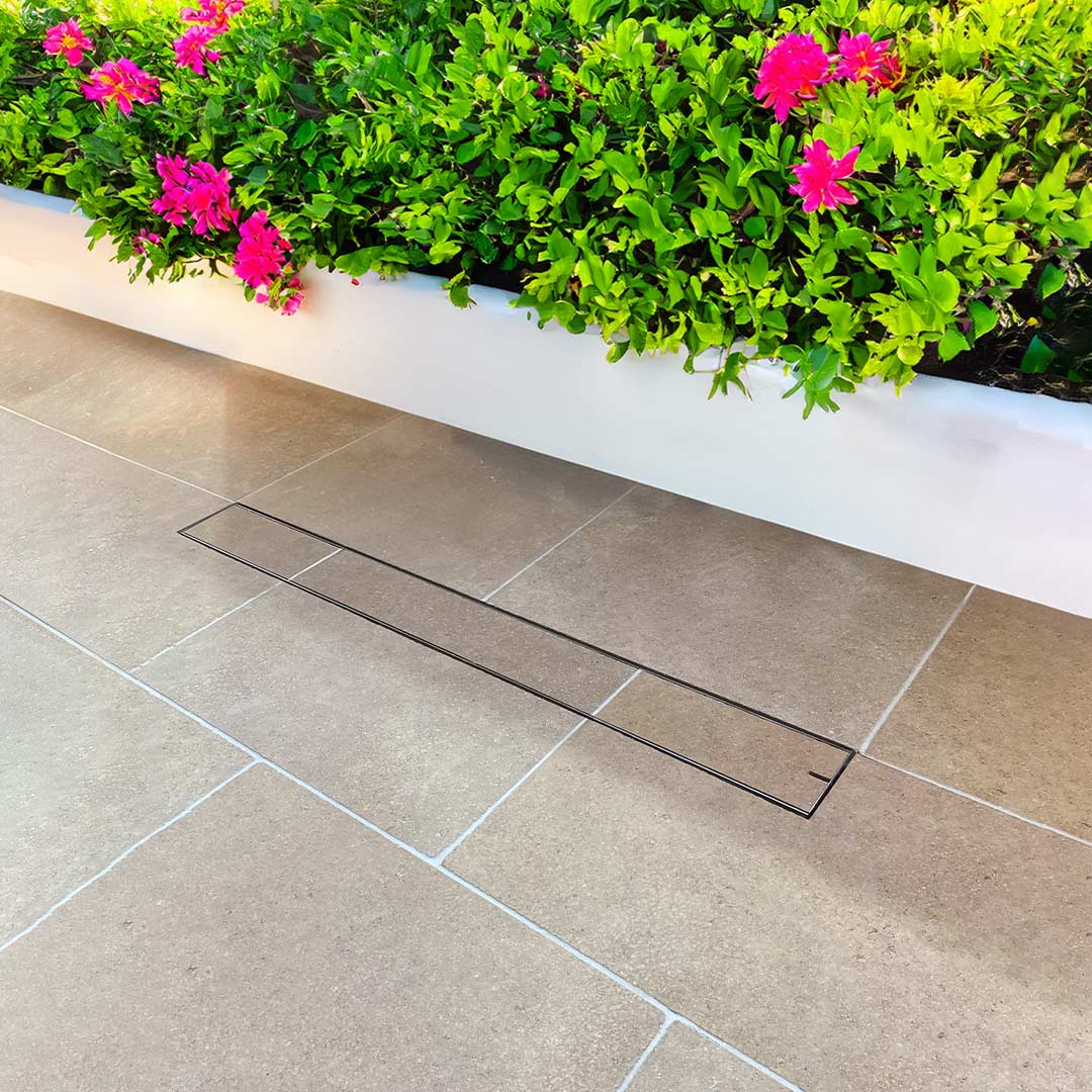 HIDE stainless steel Linear Strip Drain Cover with tile inlay.