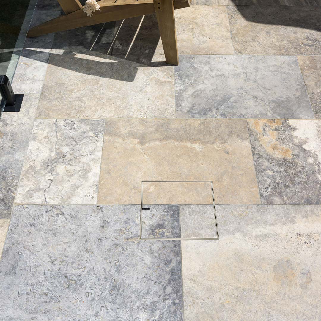 HIDE Bone Full Polymer Access Cover with tile inlay sitting flush with surrounding tiles.