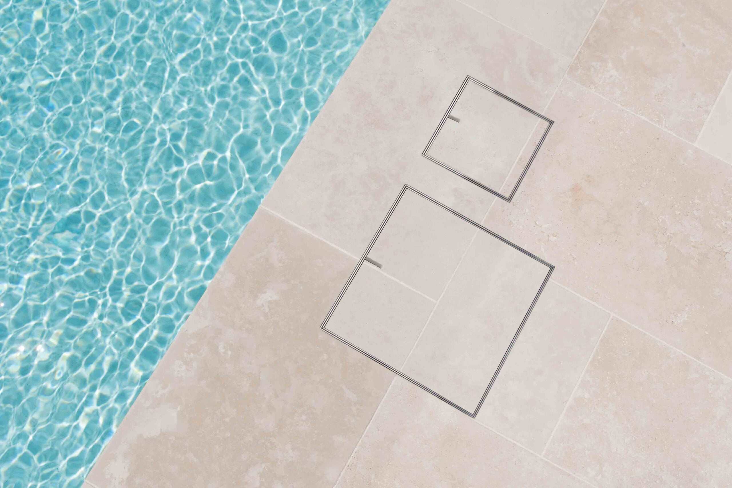 HIDE Skimmer Lid and Access Cover installed with cream tile next to swimming pool